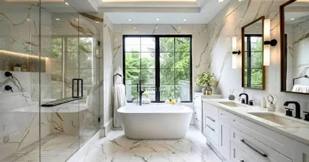 Luxury bathroom with freestanding tub, marble finishes, and frameless shower enclosure