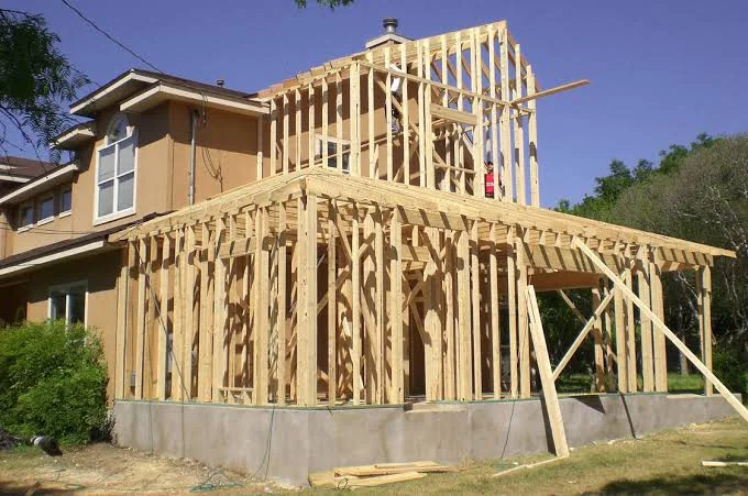Two-story wood framed home addition with concrete foundation and bracing